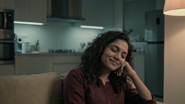 Woman relaxing at home in a cinematic wide-format brand film