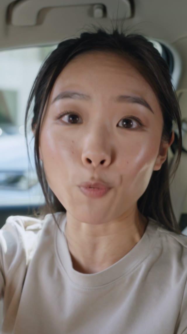 Woman speaking directly to camera from a car in a social video ad